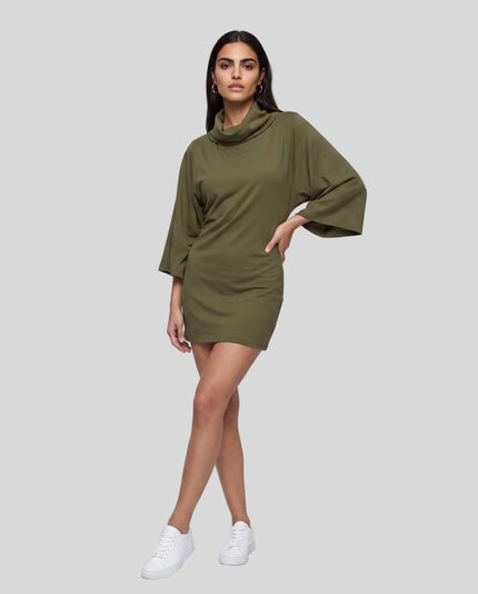 Full body front view of woman styled in Muse Cowl Tunic in army green