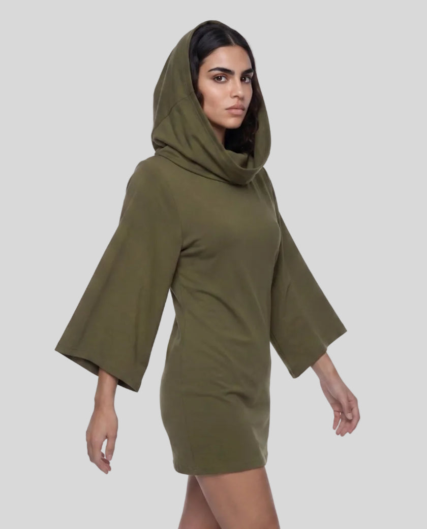 A woman modeling an army green hooded Muse Cowl Tunic dress with wide three-quarter sleeves