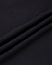 Closeup of soft black cotton-viscose stretch knit fabric on Nova Tie-Back Tee