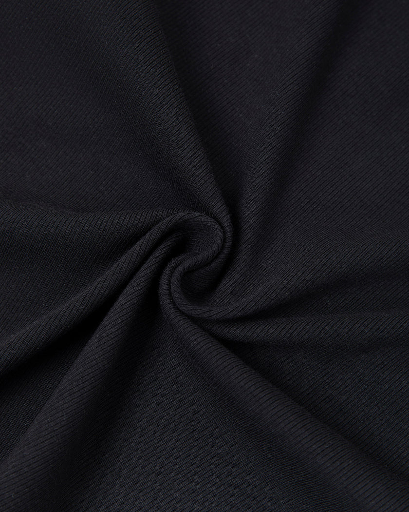 Detailed view of knit texture and fabric construction on Nova Tie-Back Tee in black