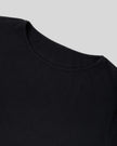 Closeup of rounded neckline and smooth knit fabric on Nova Tie-Back Tee in black
