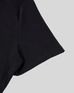 Closeup of short sleeve and stitching detail on Nova Tie-Back Tee in black