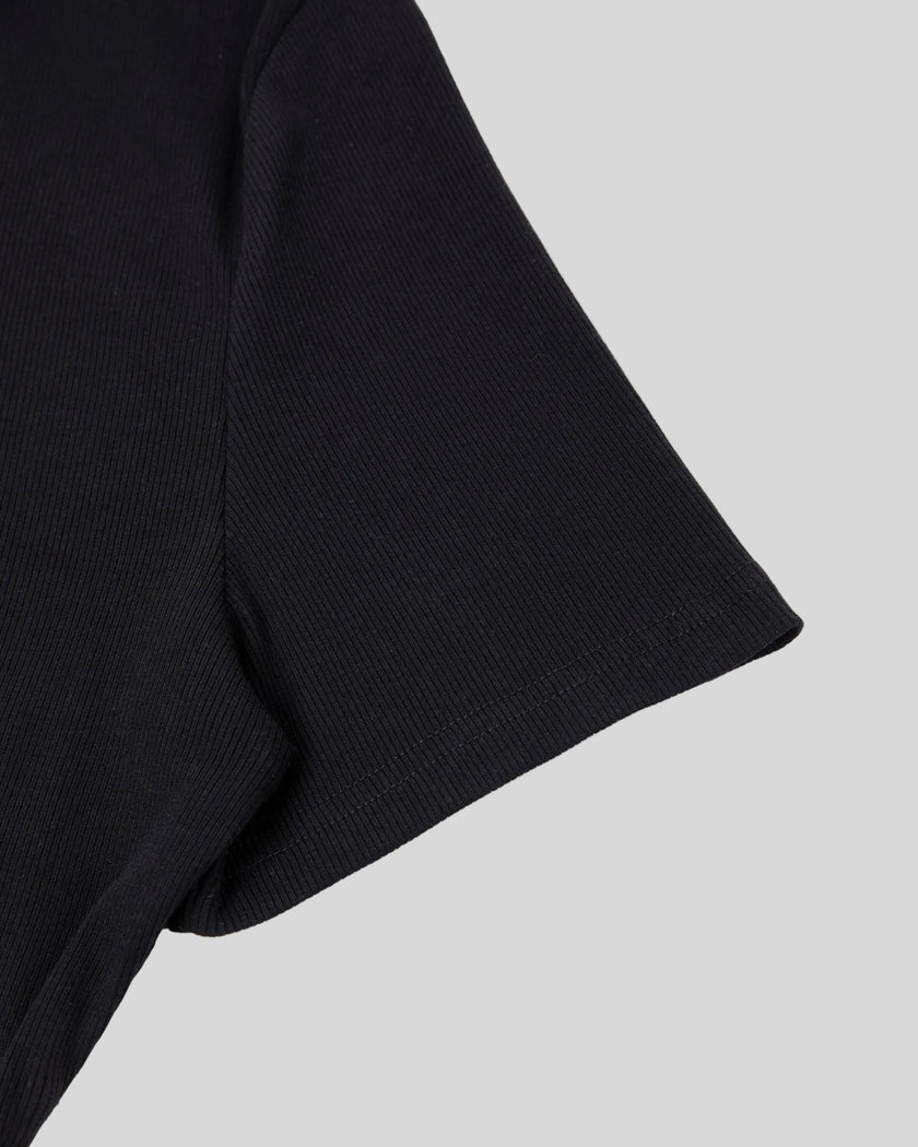 Closeup of short sleeve and stitching detail on Nova Tie-Back Tee in black