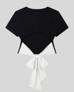 Back view of Nova Tie-Back Tee in black featuring an open back and contrasting White bow