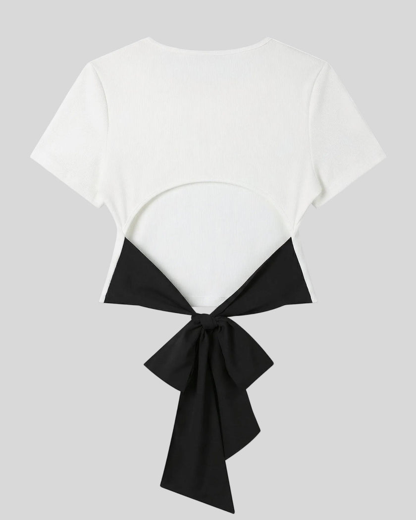 Back view of Nova Tie-Back Tee in white featuring an open back and contrasting Black bow