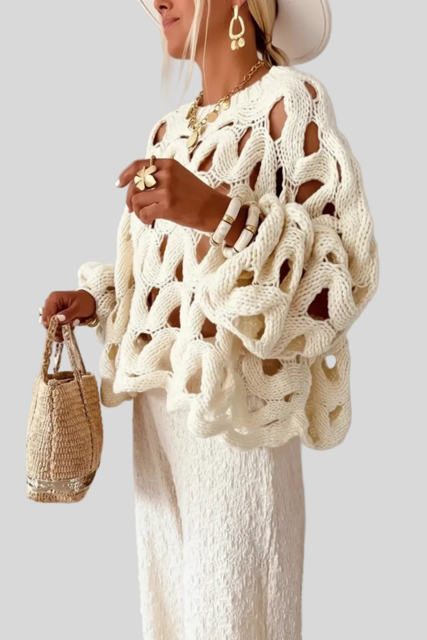 Lightweight cable knit sweater in beige with open weave, side view