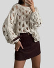 OpenWeave cable knit sweater with hollow texture, front view in white