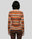 Back view of Athlesi PatternPulse Long Sleeve Top styled with brown Athlesi leggings