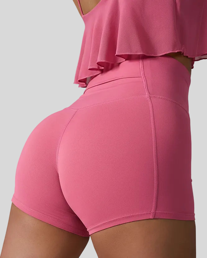 Back right view of deep pink seamless studio short with waistband pocket