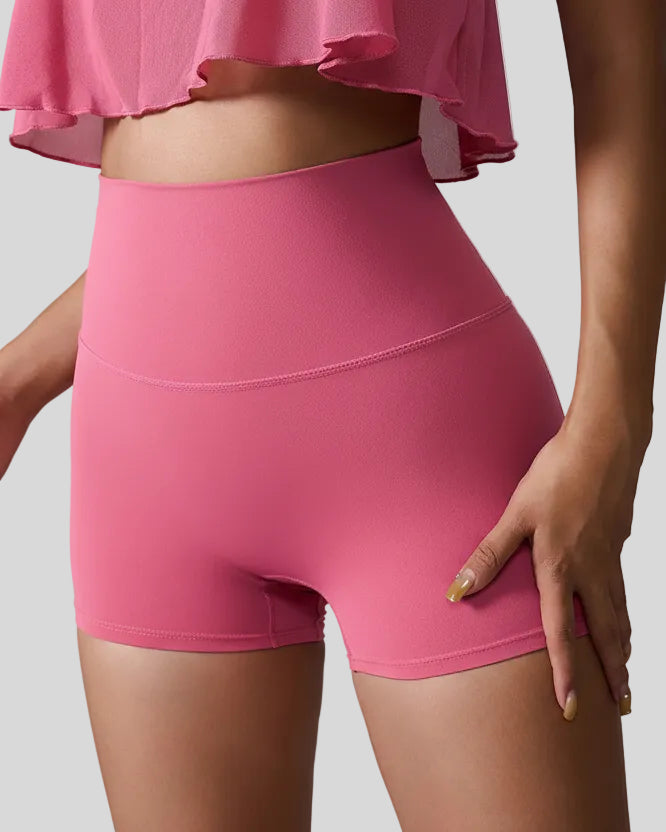 Front angle view of deep pink seamless high-waist studio short with smooth sculpting fit