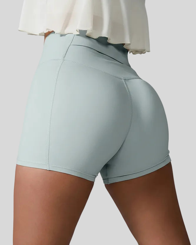 Back left view of light green seamless high-waist short with rear pocket