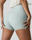 Back right view of light green seamless studio short with waistband pocket