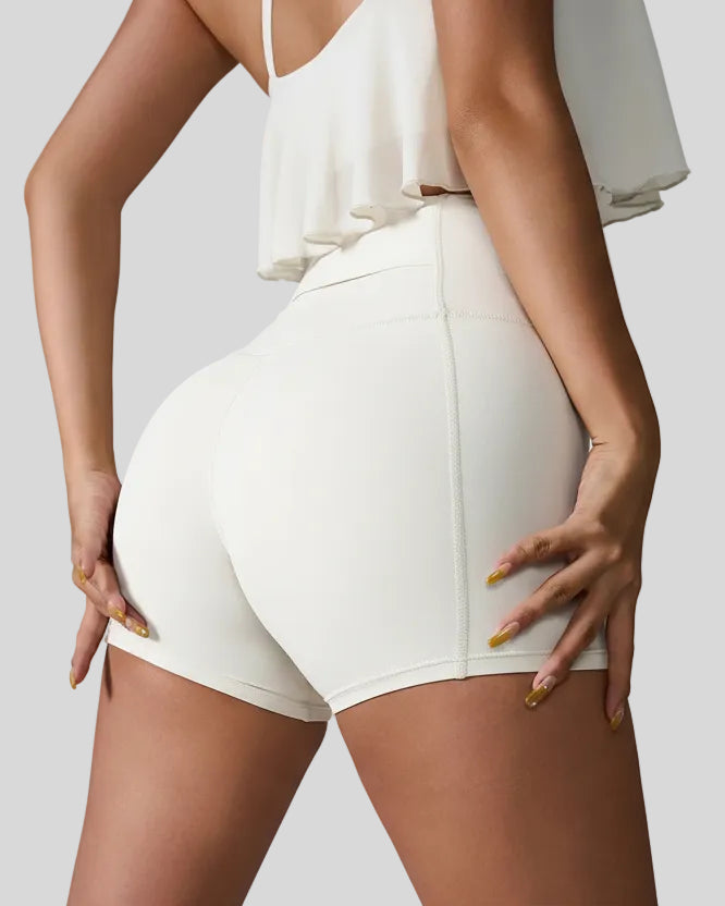 Back right view of white seamless studio short with waistband pocket
