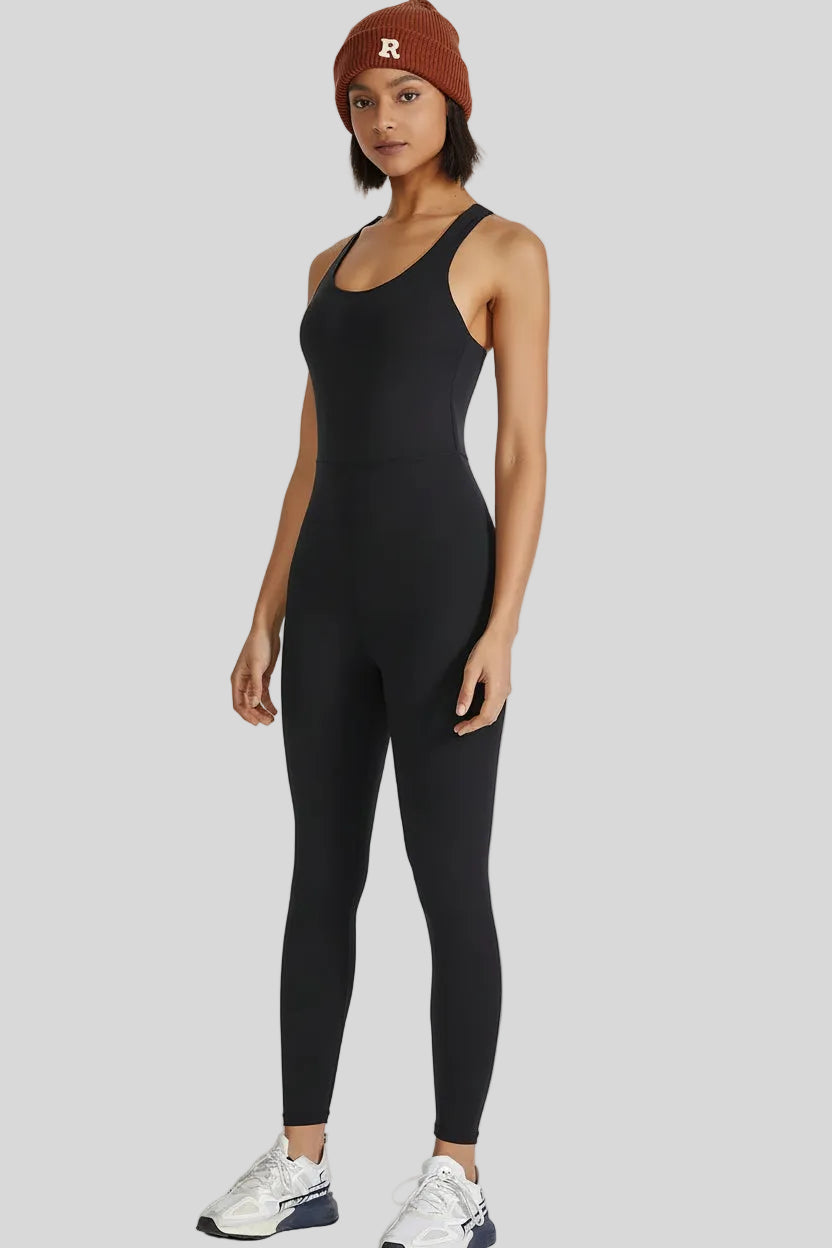 Front angle view of Athlesi PowerFlow open-back active jumpsuit in black
