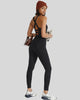 Back view of Athlesi PowerFlow open-back active jumpsuit showing crisscross strap design in black