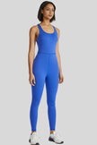 Front angle view of Athlesi PowerFlow open-back active jumpsuit in blue