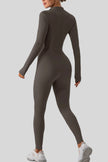 Back view of Athlesi PowerSculpt half-zip long sleeve jumpsuit in dark gray