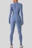 Back view of Athlesi PowerSculpt half-zip long sleeve jumpsuit in light blue