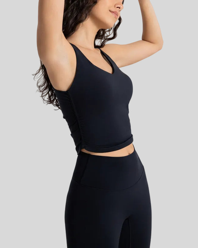 Side view of Athlesi PulseCore cropped sport tank in black