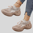 Side angled view of khaki mesh sneakers highlighting dynamic shape and layered design