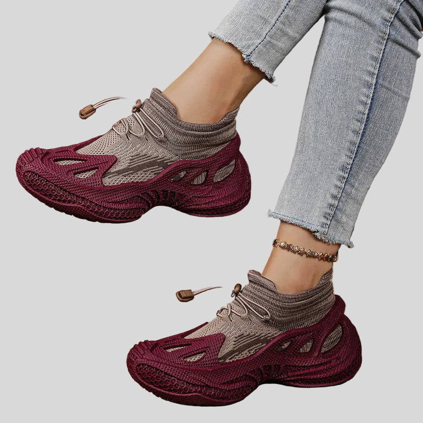 Purple mesh sneakers side view showing sculpted sole and breathable upper design