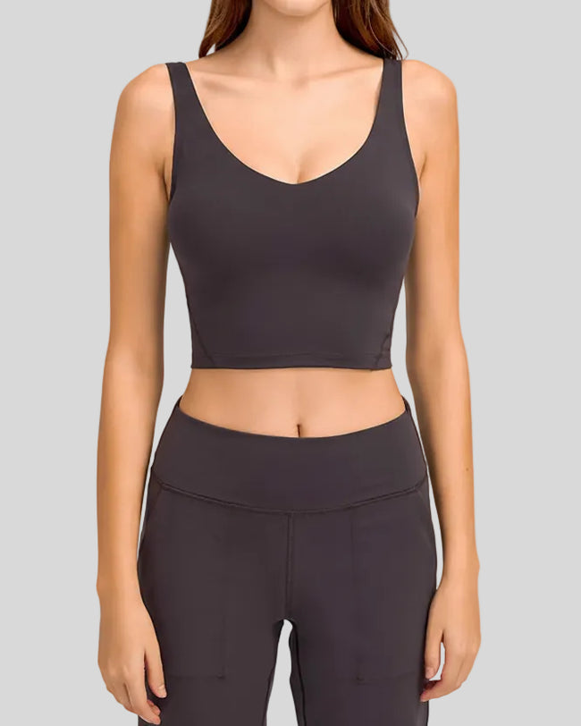 PureForm deep V sports bra in dark gray front view minimal cropped design
