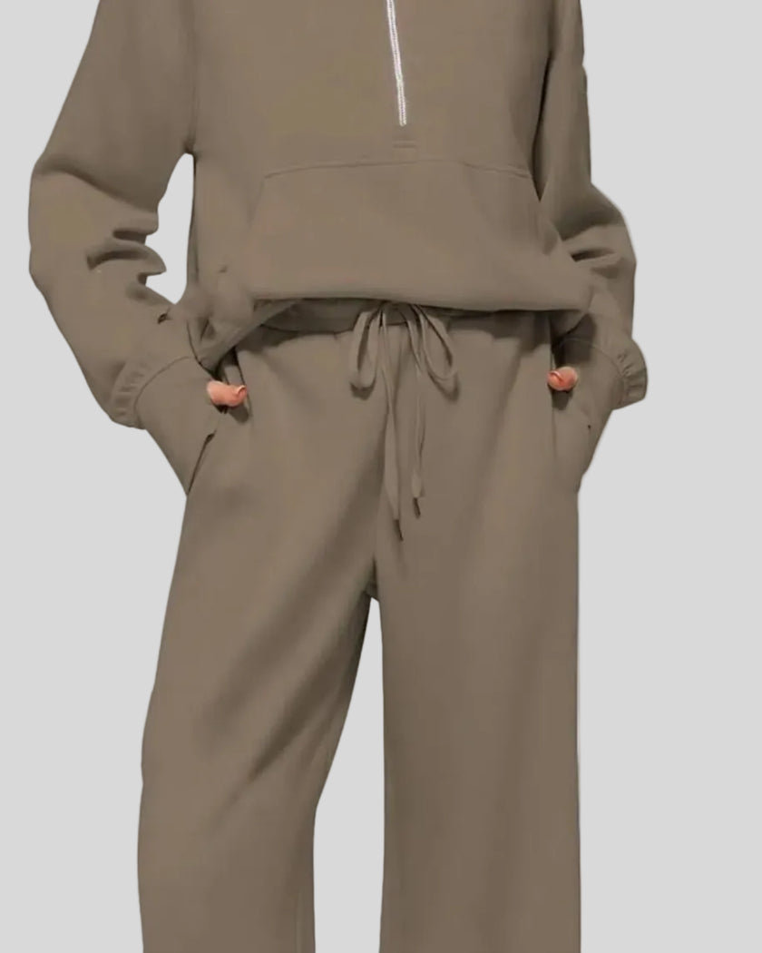 Close-up of Athlesi PureMotion Half-Zip Lounge Set showing half-zip neckline and fabric texture in brown