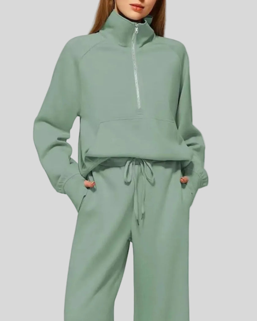 Close-up of Athlesi PureMotion Half-Zip Lounge Set showing half-zip neckline and fabric texture in green