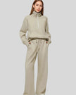 Woman wearing Athlesi PureMotion Half-Zip Lounge Set in khaki, front full body view