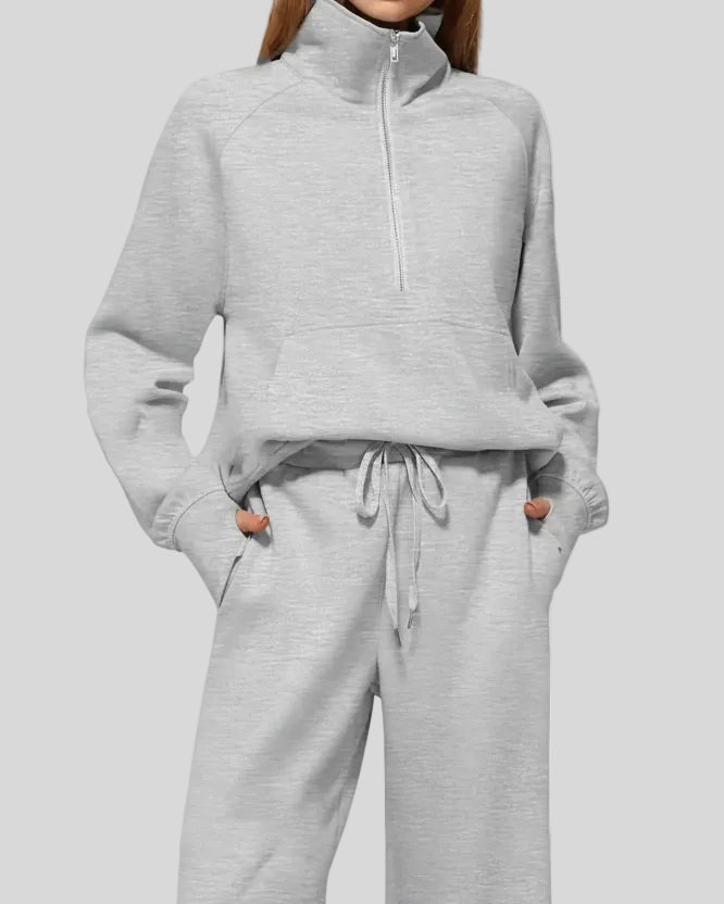 Close-up of Athlesi PureMotion Half-Zip Lounge Set showing half-zip neckline and fabric texture in light gray