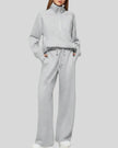 Woman wearing Athlesi PureMotion Half-Zip Lounge Set in light gray, front full body view