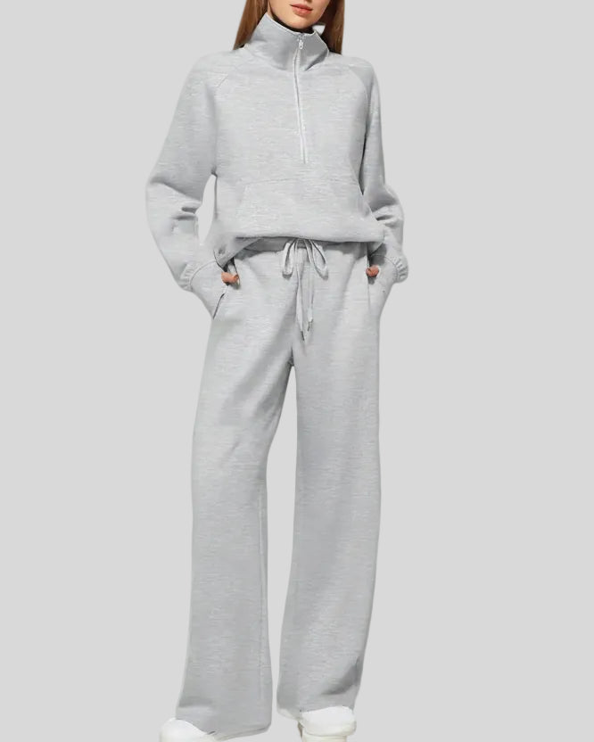Woman wearing Athlesi PureMotion Half-Zip Lounge Set in light gray, front full body view