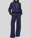 Woman wearing Athlesi PureMotion Half-Zip Lounge Set in navy, front full body view