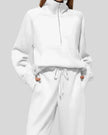 Close-up of Athlesi PureMotion Half-Zip Lounge Set showing half-zip neckline and fabric texture in white