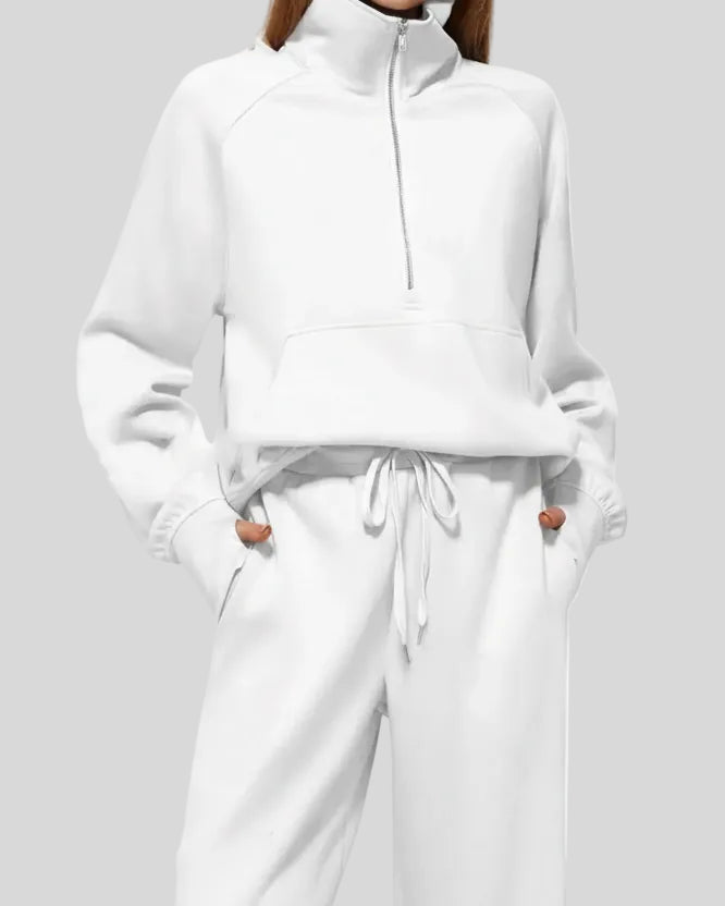 Close-up of Athlesi PureMotion Half-Zip Lounge Set showing half-zip neckline and fabric texture in white