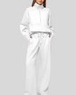 Woman wearing Athlesi PureMotion Half-Zip Lounge Set in white, front full body view