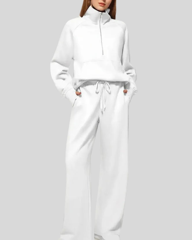 Woman wearing Athlesi PureMotion Half-Zip Lounge Set in white, front full body view