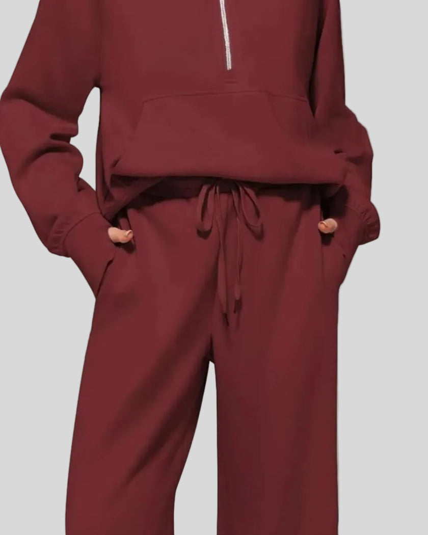 Close-up of Athlesi PureMotion Half-Zip Lounge Set showing half-zip neckline and fabric texture in wine red