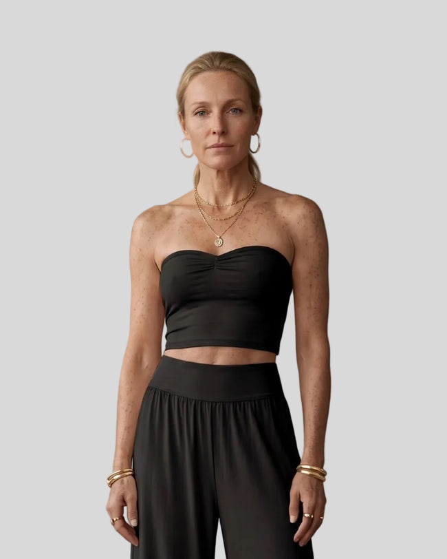Model wearing the Athlesi QuietForm Ruched Tube Top in Black, mid-body front view.