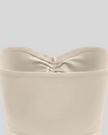 Back close-up of Athlesi QuietForm Ruched Tube Top in Pale Khaki showing the smooth fitted construction
