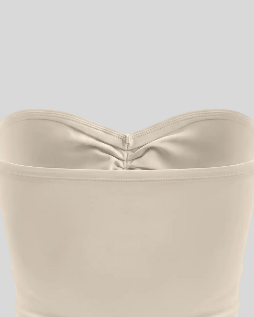 Back close-up of Athlesi QuietForm Ruched Tube Top in Pale Khaki showing the smooth fitted construction
