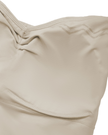 Interior chest padding detail of the Athlesi QuietForm Ruched Tube Top in Pale Khaki