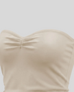 Side angle close-up of Athlesi QuietForm Ruched Tube Top in Pale Khaki showing the fitted cropped silhouette