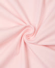 Detailed view of the lightweight cotton-stretch fabric and drape of the Athlesi QuietForm Wide Leg Pants in Pink