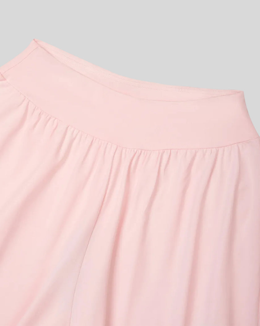 Front close-up of Athlesi QuietForm Wide Leg Pants in Pink showing the wide high-rise waistband and softly gathered fabric