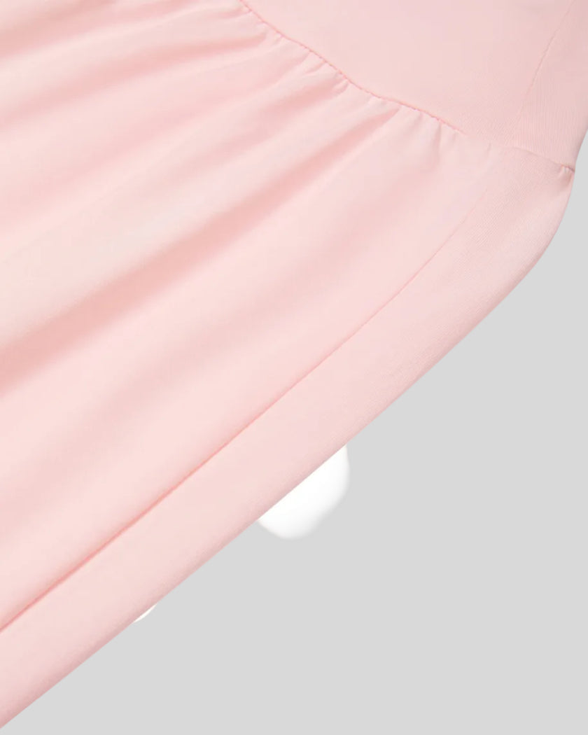 Side angle close-up of Athlesi QuietForm Wide Leg Pants in Pink highlighting the relaxed fit and fluid drape