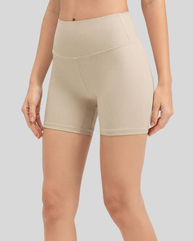 Ribbed wide-waist active shorts in tan, angled front view