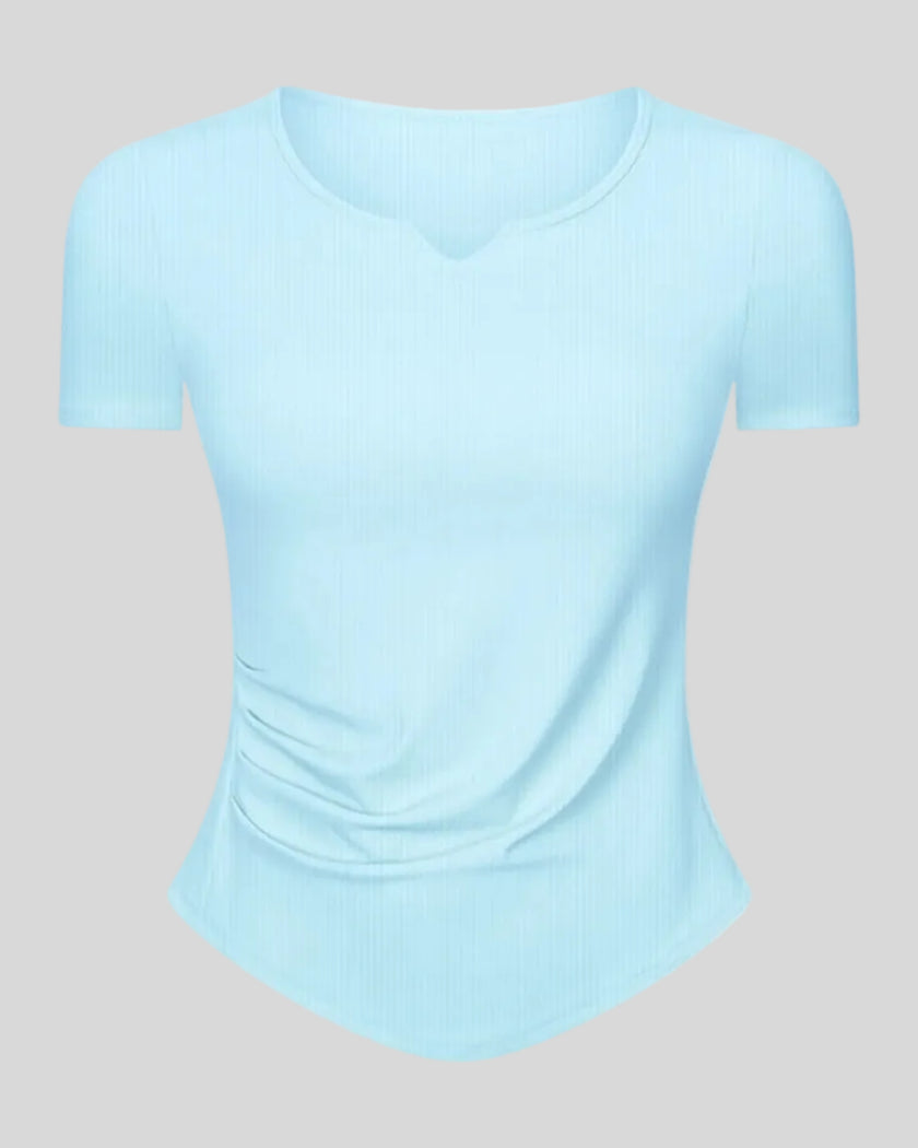 Ribnotch short sleeve active top in pastel blue, angled front view