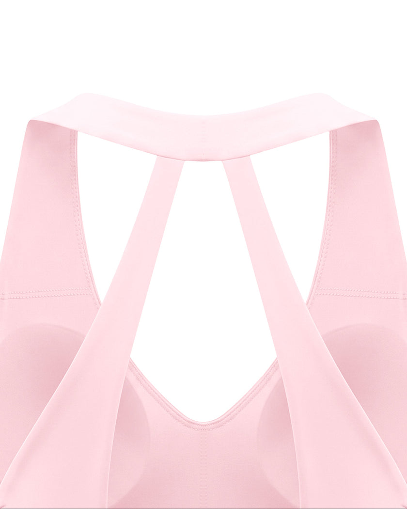 Closeup of open-back strap construction on Sculpt Halter Sports Bra in pink
