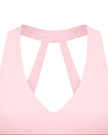 Closeup of V-neckline on Sculpt Halter Sports Bra in pink
